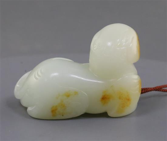 A Chinese white jade figure of a recumbent lion-dog, possibly 18th century, 5.9cm